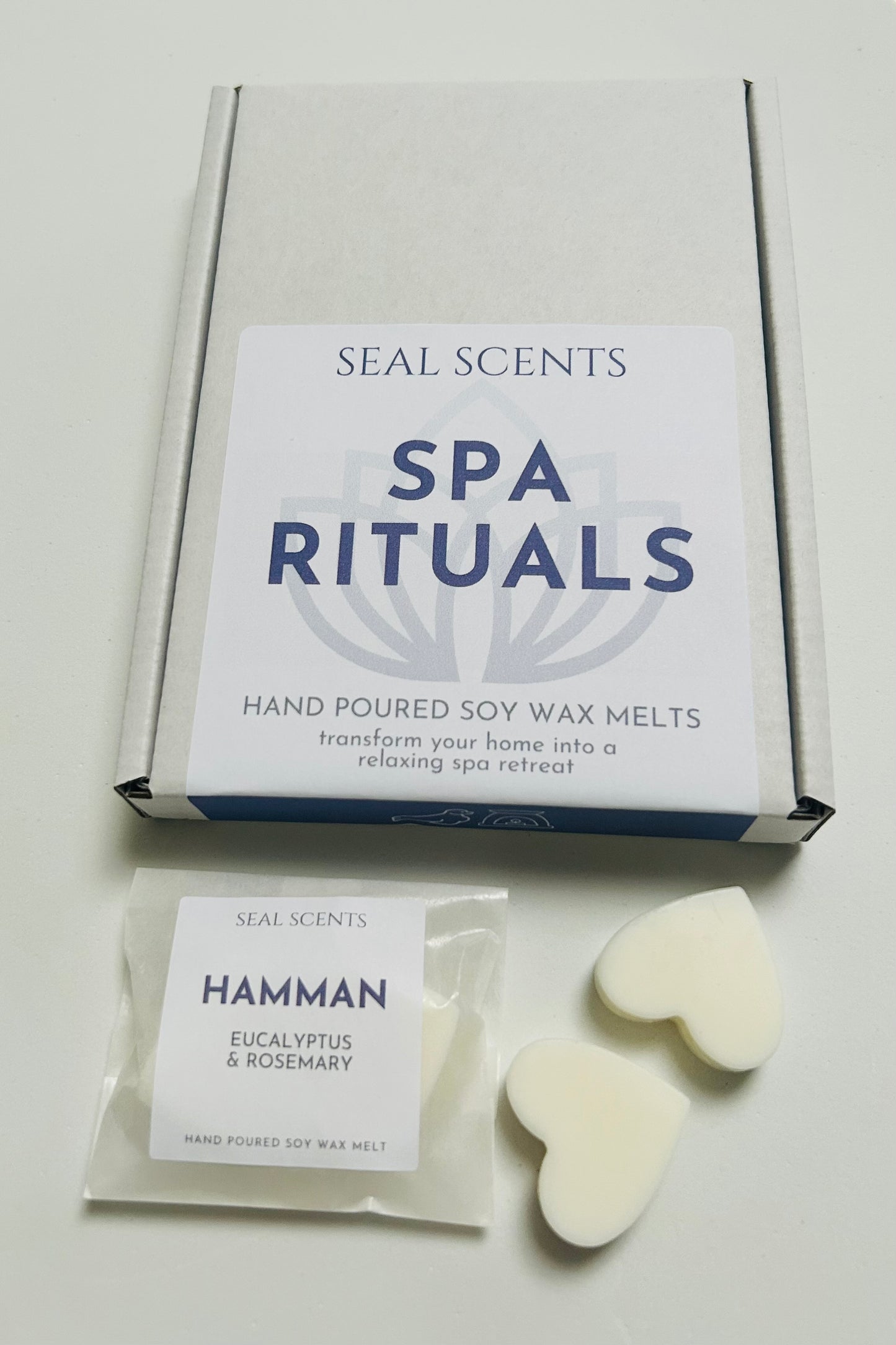 Box of Seal Scents Spa Rituals hand poured soy wax melts with a sample on a light gray background