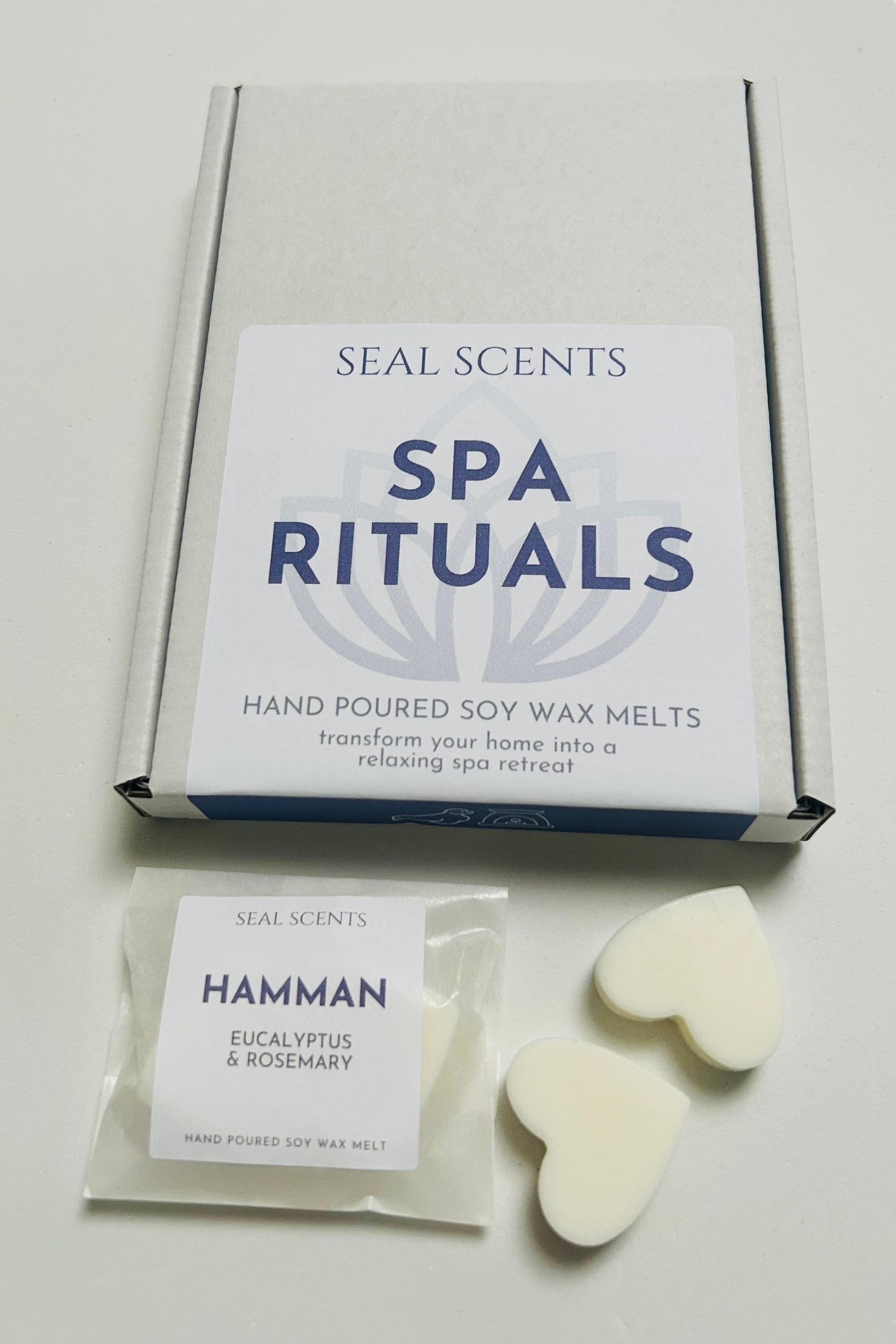 Box of Seal Scents Spa Rituals hand poured soy wax melts with a sample on a light gray background